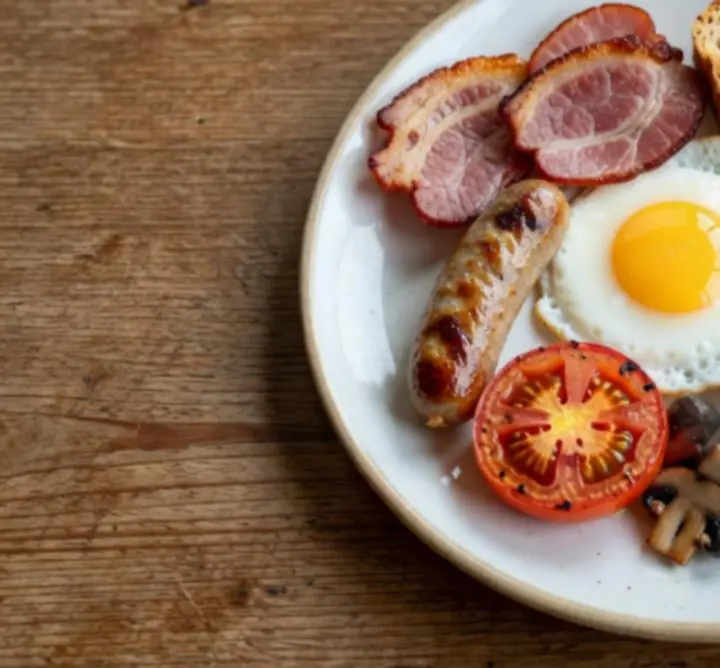 Signature Full Irish breakfast plate with eggs, sausages, bacon, and toast.